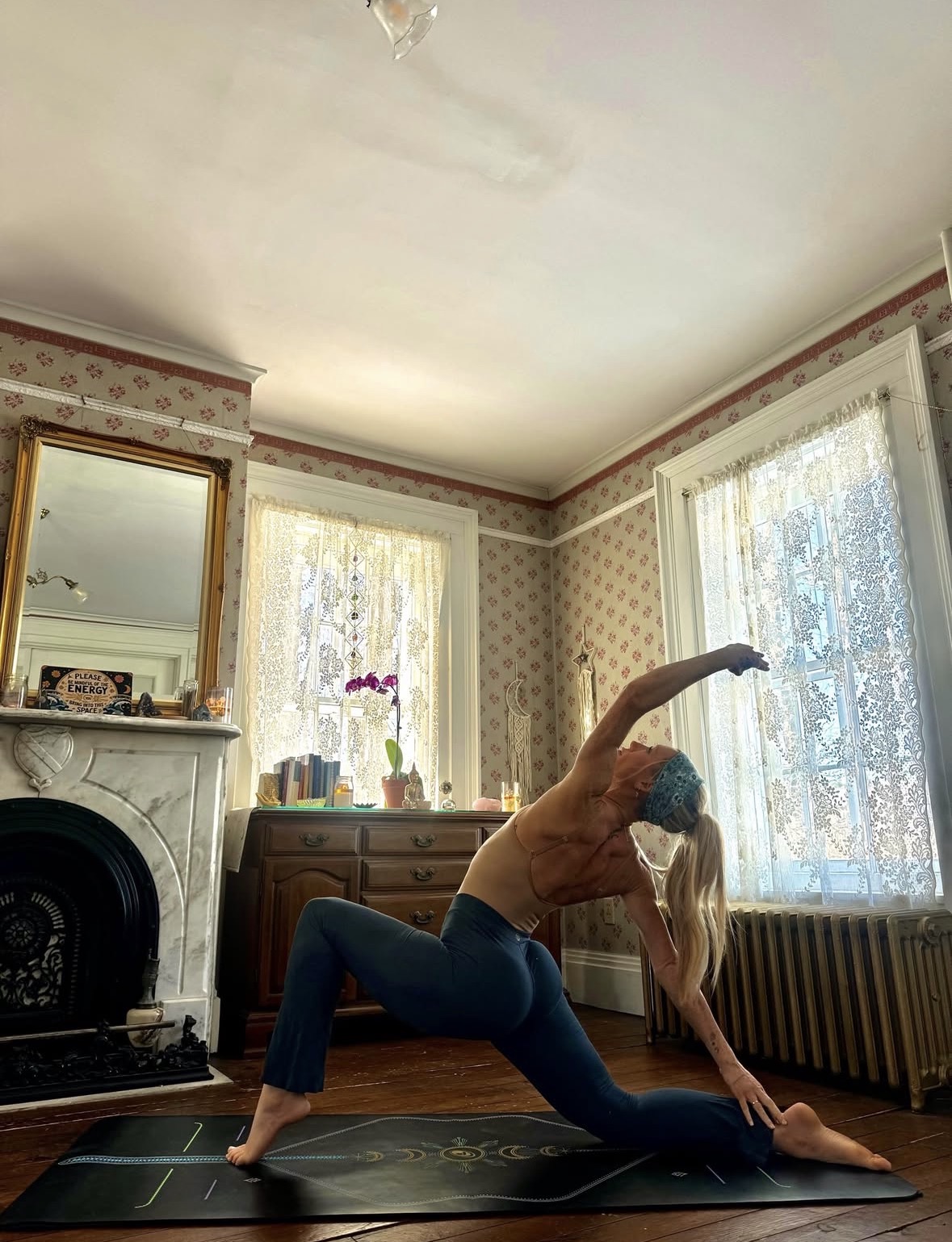 Wild Sol Yoga owner Amelia Robbins practicing in the studio